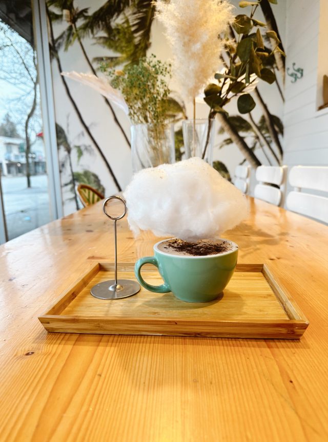 Hot chocolate at Honolulu Coffee with rain cloud cotton candy above